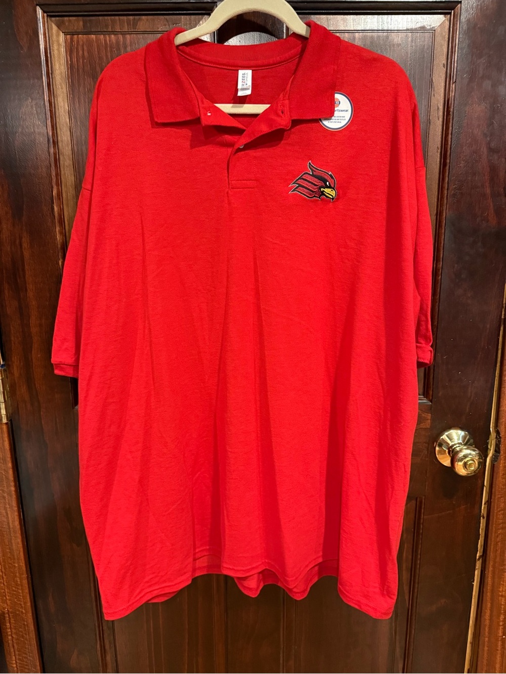 Red Men's Polo Shirt with Embroidered Wheeling Jesuit Cardinal Logo